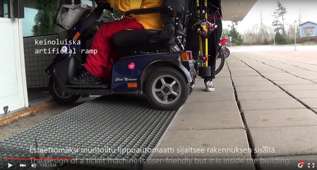Imatra train station. Electric wheelchair is trying to enter the station but the door has a threshold.